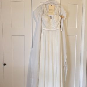 Brand new, ivory wedding gown.